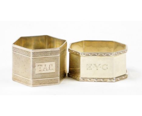 Two silver napkin rings, to include an hexagonal ring with heavy engine turned decoration, with initial rectangular plaque ma