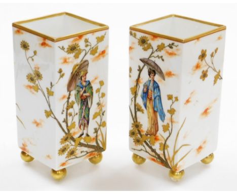 A pair of 19thC porcelain Japanesque square vases, decorated in enamel and enriched in gilt, with figures of Geisha, probably