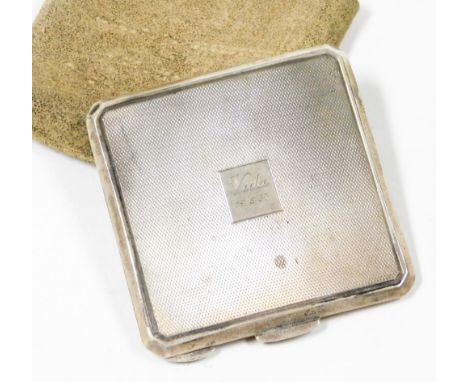 An Edward VIII silver compact, square set with engine turned detailing and central panel stamped A Vida 19.6.37, opening to r