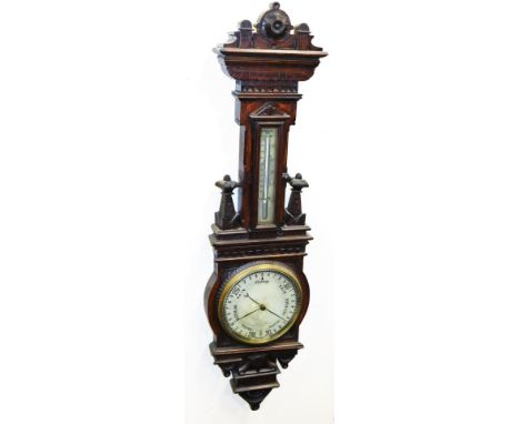 A late Victorian oak aneroid barometer, for Gardener &amp; Co, of Glasgow, Opticians to Her Majesty, with silvered dial and i