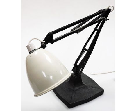 An anglepoise desk lamp, with a cream shade on black base and arched leaver movement, 41cm high when closed. 