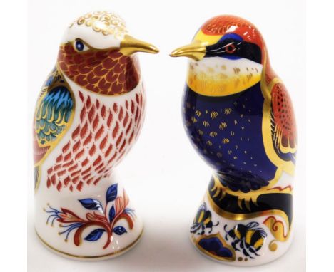 Two Royal Crown Derby paperweights, to include the bee eater, and another bird with red breast, each with silvered button, 10