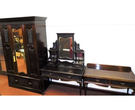 An Edwardian stained walnut bedroom suite, comprising single wardrobe, dressing table and side table, each with crossed detai