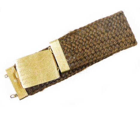A Victorian memorial bracelet, the interweaved hair design bracelet with yellow metal clasps, the plaque inscribed hair of Ca