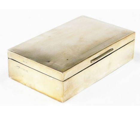An Elizabeth II silver cigarette box, with engine turned top and cedar fitted interior, Birmingham 1961, 16.5cm x 10cm, 20½oz