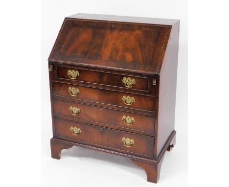A George III style flamed mahogany bureau, the fall flap opening to reveal fitted interior above one short and four long draw