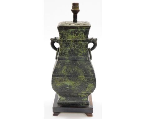 A Chinese bronze vase of square section, converted to a table lamp, with relief archaic style decoration, animal head and rin