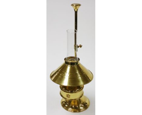 A brass table lamp, with a domed shade converted from an oil lamp, 59cm high. 