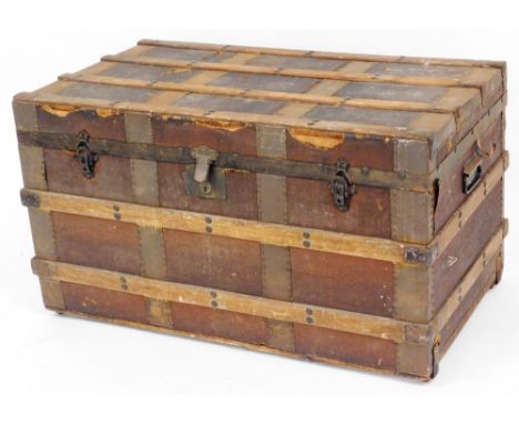 A canvas and wood bound travelling trunk, 50cm high, 91cm wide, 53cm deep. 