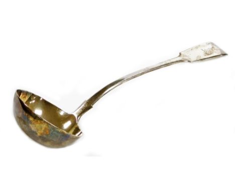 A Victorian silver fiddle pattern serving ladle, with arched handle and bearing crest for the Fillingham Family formerly of S