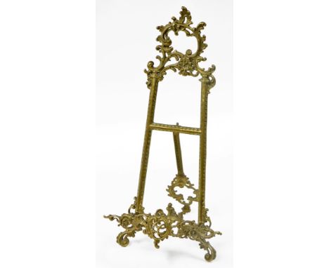 A brass rococo style book easel stand, 53cm high, 27cm wide.