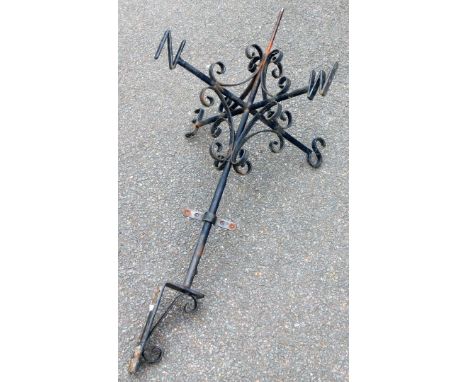A wrought iron weather vane, with spiral supports, 95cm high.