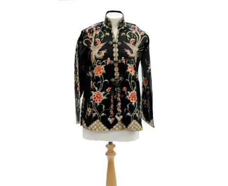 A lady's vintage Chinese bed jacket, the black satin ground embroidered with dragon birds, flowers and foliage with fish scal