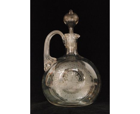 A late 19th Century Stourbridge crystal glass claret jug of compressed globe and shaft for with an applied fluted handle all 