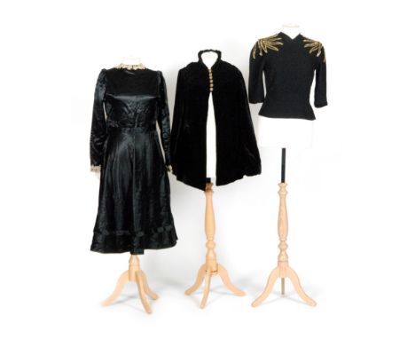 A 1930s/40s lady's vintage black crepe bodice top with gold beadwork to the shoulders and a darted sunray to the waist, label