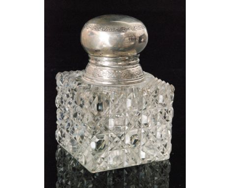 A hallmarked silver and clear glass ink well of square section with hobnail cut base below plain silver collar and hinged lid