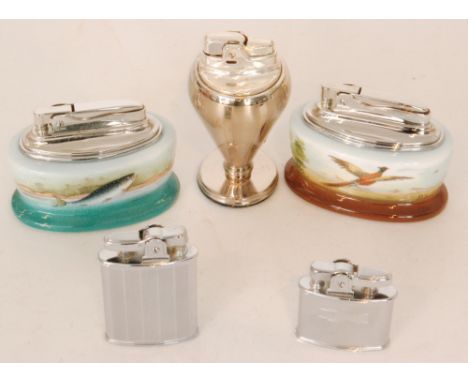 A collection of three boxed Ronson porcelain table lighters titled Game, Leaping Fish and a baluster chrome example together 