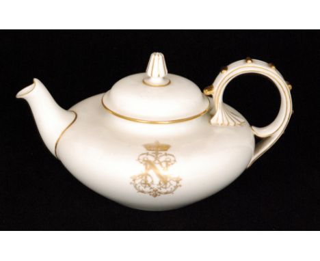 An early 20th Century Sevres teapot of compressed form decorated with two gilt Imperial ciphers for Napoleon III, printed Dor