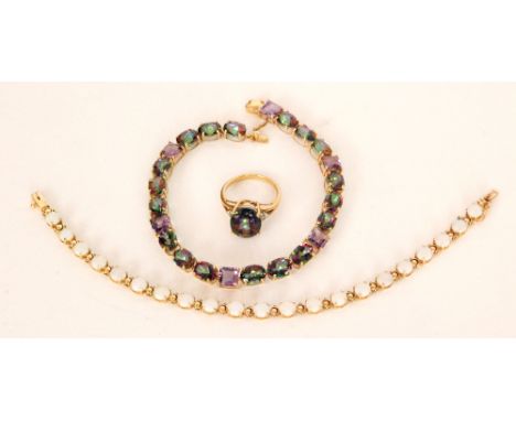A 10ct opal bracelet formed with twenty one circular opal cabochons, claw set with tongue and box clasp, together with a myst