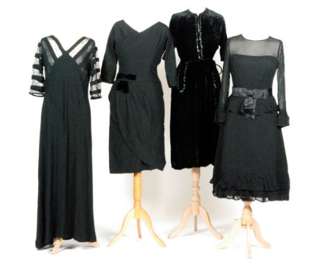 Four assorted lady's vintage black dresses comprising a 1960s Hardy Amies dress with a black velvet bow to the waist, a 1960s