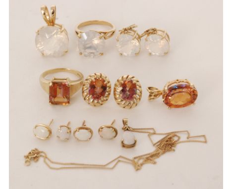 A 9ct opal pendant with two pairs of matching push and post earrings and two suites of 9ct stone set jewellery to include mat