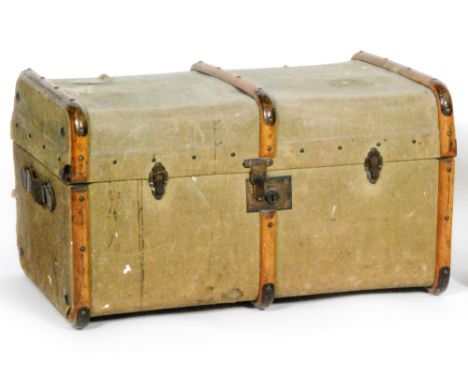 An early 20th Century canvas steamer cabin trunk, with wooden trim and bearing a Cunard White Star Cabin Class luggage label,