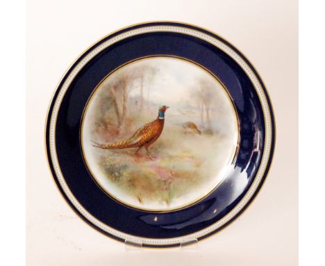 A Grainger & Co, Royal China Works Worcester cabinet plate decorated by James Stinton with a hand painted pheasant and grouse