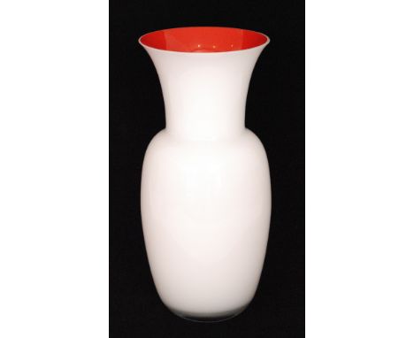 A contemporary Italian Murano glass vase of ovoid form below a flared neck in opal over the red interior all cased in clear c