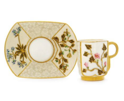 A late 19th Century Royal Worcester Aesthetic cabinet cup and saucer decorated in relief with flowers and foliage heightened 