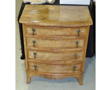 A 20th Century walnut bow front chest of four long drawers on splayed bracket feet, width 66cm