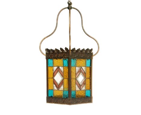 A late 19th to early 20th Century hall lantern, with leaded coloured glass panel sides within repousse work foliate borders, 