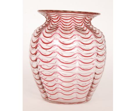 A 1940s Stevens & Williams crystal glass vase of ovoid form to an everted rim decorated applied pulled loop trail in ruby ove