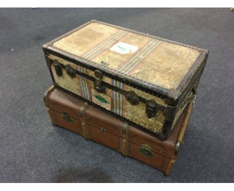 A Schunemann beech framed brown leather cabin trunk and a similar metal studded trunk (2)