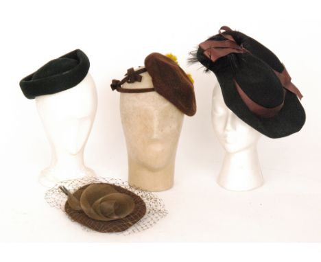 Two 1940s lady's vintage hats, the first in black felt with a brown ribbon trim and black feathers, the second in brown felt 