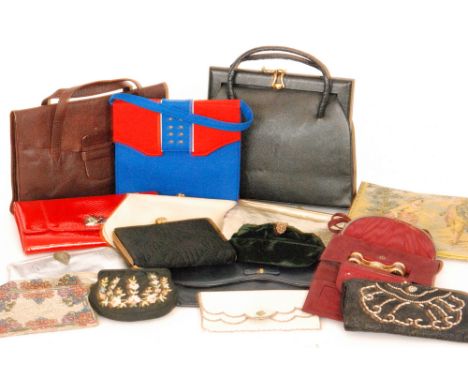 An early 20th Century lady's vintage 'opera' handbag in red suede, the various compartments containing a matching pair of ope