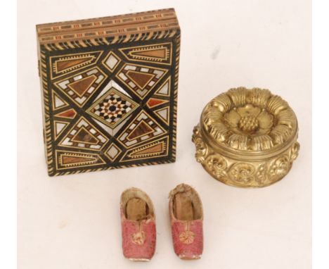 A pair of miniature shoes with ink note to sole and dated 1835 together with a small sampler, a brass floral box and a Tunbri