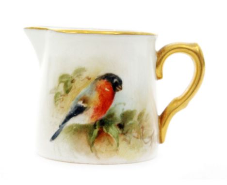 A miniature Royal Worcester cream jug decorated with a hand painted bullfinch, indistinctly signed (possibly Russell), black 