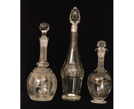 A trio of late 19th Century Continental crystal glass decanters comprising of a globe and shaft decanter decorated with an en