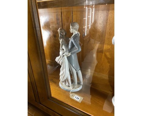 A Lladro figural group, number 1528, of a young married couple