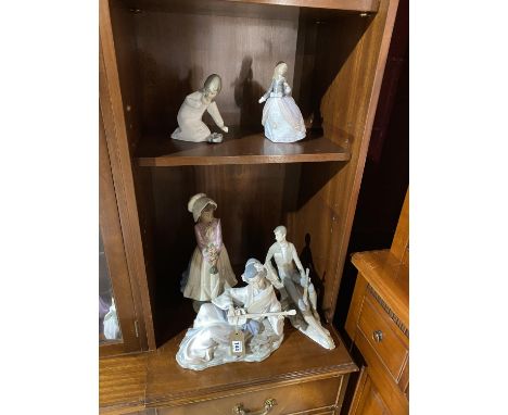 Two Lladro figures and three Nao figures