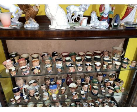 A shelf of medium, small and miniature Royal Doulton Character jugs