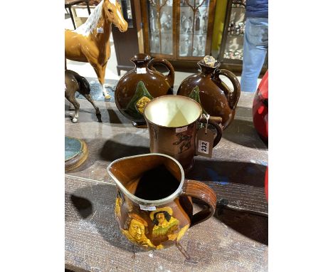 A Royal Doulton Kingsware 'Memories' pitcher, a 'Sir Francis Drake' bowling tankard and two Jovial Monk Moon flasks