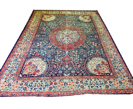 ANTIQUE TABRIZ CARPET, 330cm x 235cm, pendant medallion on a midnight blue field of flowerheads and vines within complimentar