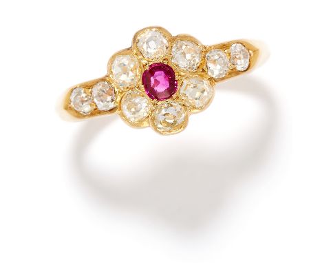 ANTIQUE RUBY AND DIAMOND RING in 18ct yellow gold, comprising of a cushion cut ruby in a cluster of old cut diamonds totallin