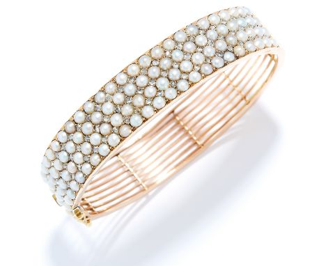 ANTIQUE SEED PEARL AND DIAMOND BANGLE in 15ct yellow gold, set with four rows of seed pearls accented by rose cut diamonds, s