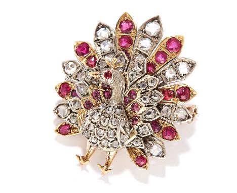 ANTIQUE RUBY AND DIAMOND PEACOCK BROOCH in gold, depicting a peacock set with cushion cut rubies and rose cut diamonds, unmar