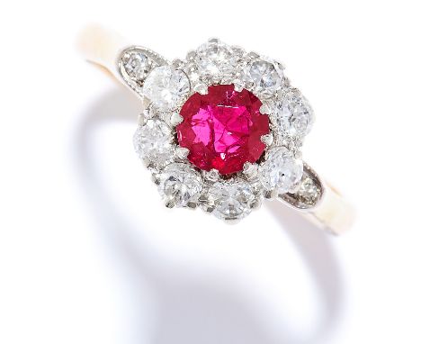RUBY AND DIAMOND CLUSTER RING in 18ct yellow gold, set with a round cut ruby of approximately 0.60 carats in a cluster of rou