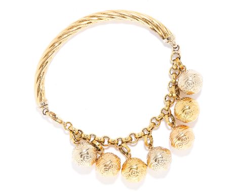 GOLD CHARM BRACELET in 18ct yellow, white and rose gold, the twisted half bangle body with belcher link chain suspending seve