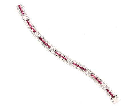 RUBY AND DIAMOND BRACELET in 18ct white gold, in Art Deco design set with step cut rubies totalling approximately 3.64 carats