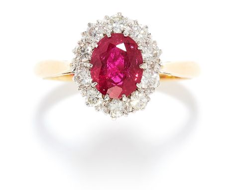 1.20 CARAT RUBY AND DIAMOND CLUSTER RING in 18ct yellow gold, set with a oval cut ruby of approximately 1.20 carats in a clus